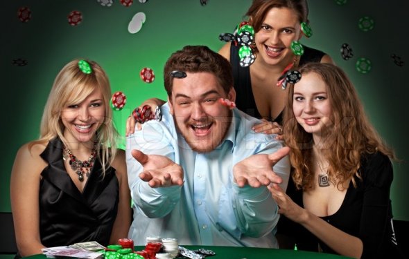 Poker players in casino with