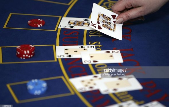 A croupier deals cards on a