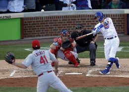 Javier Baez hits a three-run home run during the second inning of Game 4 of the NLDS at Wrigley Field. AP