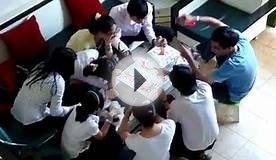 Young Vietnamese playing card game - with money